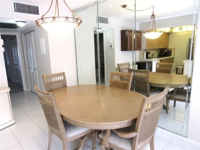 TURNKEY 1 BEDROOM, 1.5 BATHS. TILE IN LIVING AREAS, CARPET IN on Wynmoor Golf Course in Florida - for sale on GolfHomes.com, golf home, golf lot