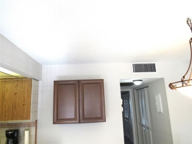 TURNKEY 1 BEDROOM, 1.5 BATHS. TILE IN LIVING AREAS, CARPET IN on Wynmoor Golf Course in Florida - for sale on GolfHomes.com, golf home, golf lot