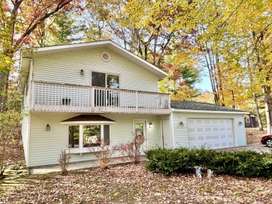 LEWISTON - This charming colonial style home offers the right on Garland Resort and Golf Club  in Michigan - for sale on GolfHomes.com, golf home, golf lot