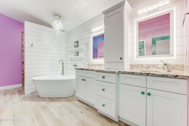 Make this beautifully updated home your new address in gated on Plantation Bay Golf and Country Club in Florida - for sale on GolfHomes.com, golf home, golf lot
