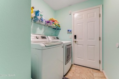 Make this beautifully updated home your new address in gated on Plantation Bay Golf and Country Club in Florida - for sale on GolfHomes.com, golf home, golf lot