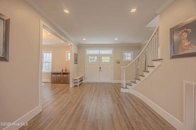 Upscale living with long golf views of Hole #3 of the on River Landing Golf Course in North Carolina - for sale on GolfHomes.com, golf home, golf lot