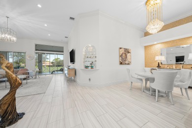 Experience timeless elegance and effortless living in this on BallenIsles Golf and Country Club in Florida - for sale on GolfHomes.com, golf home, golf lot