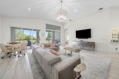 Experience timeless elegance and effortless living in this on BallenIsles Golf and Country Club in Florida - for sale on GolfHomes.com, golf home, golf lot