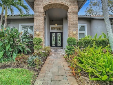 Under contract-accepting backup offers. Exquisite Home on the on East Lake Woodlands Country Club in Florida - for sale on GolfHomes.com, golf home, golf lot