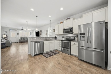 Welcome to 301 Bulkhead Bend, a bright and spacious end-unit in on Carolina Shores Golf Course in North Carolina - for sale on GolfHomes.com, golf home, golf lot