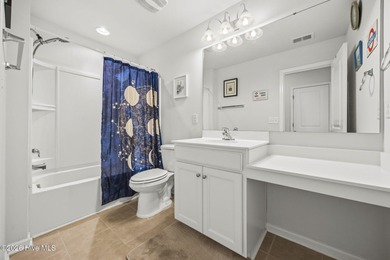 Welcome to 301 Bulkhead Bend, a bright and spacious end-unit in on Carolina Shores Golf Course in North Carolina - for sale on GolfHomes.com, golf home, golf lot