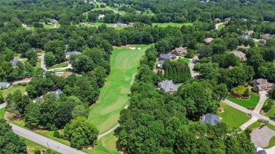 Lovely .68-acre lot perfectly situated at the 11th tee of the on Royal Lakes Golf and Country Club in Georgia - for sale on GolfHomes.com, golf home, golf lot