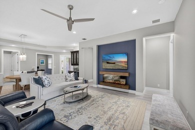 Come see this beautifully upgraded Toll Brothers Pesaro model on Jupiter Country Club in Florida - for sale on GolfHomes.com, golf home, golf lot