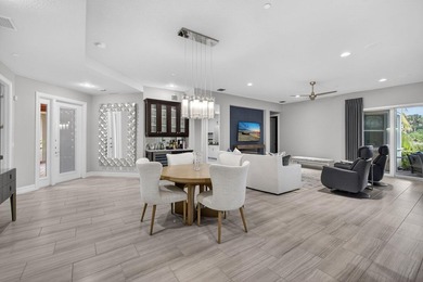 Come see this beautifully upgraded Toll Brothers Pesaro model on Jupiter Country Club in Florida - for sale on GolfHomes.com, golf home, golf lot