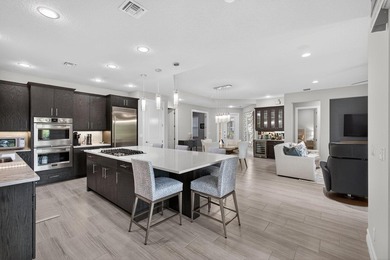 Come see this beautifully upgraded Toll Brothers Pesaro model on Jupiter Country Club in Florida - for sale on GolfHomes.com, golf home, golf lot