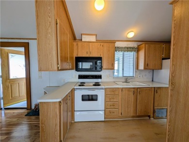 This home is immaculate. Well maintained. Fabulous front deck on Riverview Golf Course in Arizona - for sale on GolfHomes.com, golf home, golf lot