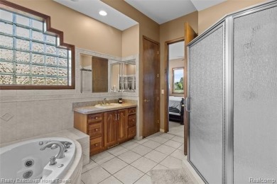 Located on one of Golfside's most desirable lots, this custom R on St Clair River Country Club in Michigan - for sale on GolfHomes.com, golf home, golf lot