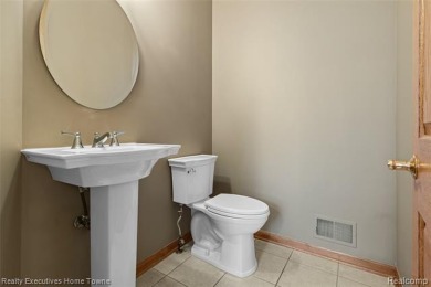 Located on one of Golfside's most desirable lots, this custom R on St Clair River Country Club in Michigan - for sale on GolfHomes.com, golf home, golf lot