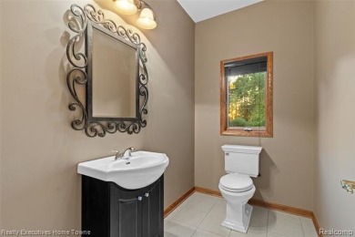 Located on one of Golfside's most desirable lots, this custom R on St Clair River Country Club in Michigan - for sale on GolfHomes.com, golf home, golf lot