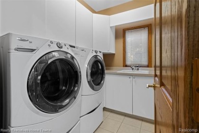 Located on one of Golfside's most desirable lots, this custom R on St Clair River Country Club in Michigan - for sale on GolfHomes.com, golf home, golf lot