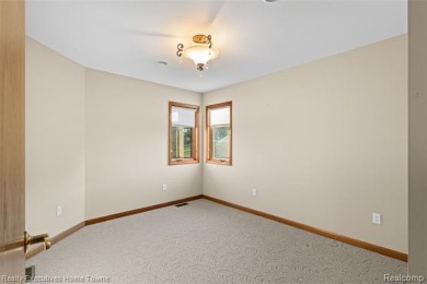 Located on one of Golfside's most desirable lots, this custom R on St Clair River Country Club in Michigan - for sale on GolfHomes.com, golf home, golf lot