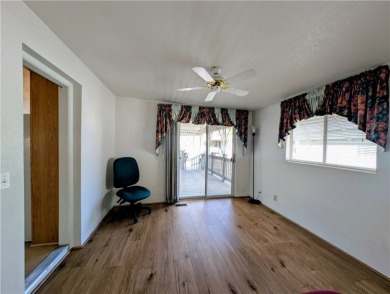 This home is immaculate. Well maintained. Fabulous front deck on Riverview Golf Course in Arizona - for sale on GolfHomes.com, golf home, golf lot