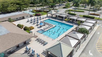 Fully furnished TURNKEY unit with full sized washer and dryer on Wynmoor Golf Course in Florida - for sale on GolfHomes.com, golf home, golf lot