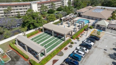 Fully furnished TURNKEY unit with full sized washer and dryer on Wynmoor Golf Course in Florida - for sale on GolfHomes.com, golf home, golf lot