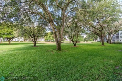Fully furnished TURNKEY unit with full sized washer and dryer on Wynmoor Golf Course in Florida - for sale on GolfHomes.com, golf home, golf lot