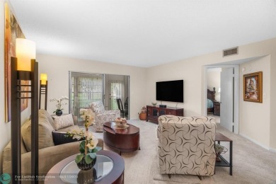 Fully furnished TURNKEY unit with full sized washer and dryer on Wynmoor Golf Course in Florida - for sale on GolfHomes.com, golf home, golf lot