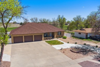 This beautifully updated rancher is a true gem--backing right up on Desert Hawk At Pueblo West in Colorado - for sale on GolfHomes.com, golf home, golf lot