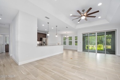 Enjoy peaceful water and wooded views in this beautifully on Venetian Bay Golf Course in Florida - for sale on GolfHomes.com, golf home, golf lot