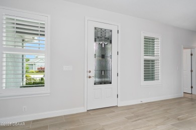 Enjoy peaceful water and wooded views in this beautifully on Venetian Bay Golf Course in Florida - for sale on GolfHomes.com, golf home, golf lot