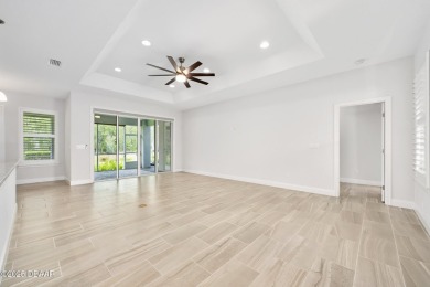Enjoy peaceful water and wooded views in this beautifully on Venetian Bay Golf Course in Florida - for sale on GolfHomes.com, golf home, golf lot
