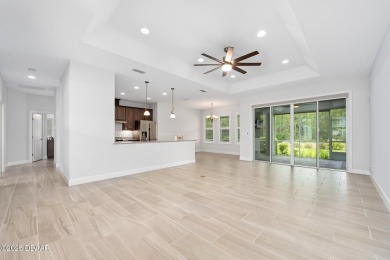 Enjoy peaceful water and wooded views in this beautifully on Venetian Bay Golf Course in Florida - for sale on GolfHomes.com, golf home, golf lot