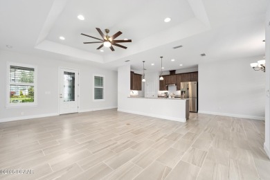 Enjoy peaceful water and wooded views in this beautifully on Venetian Bay Golf Course in Florida - for sale on GolfHomes.com, golf home, golf lot