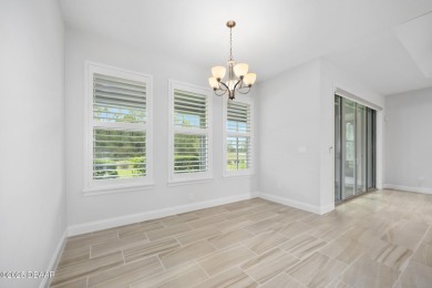 Enjoy peaceful water and wooded views in this beautifully on Venetian Bay Golf Course in Florida - for sale on GolfHomes.com, golf home, golf lot
