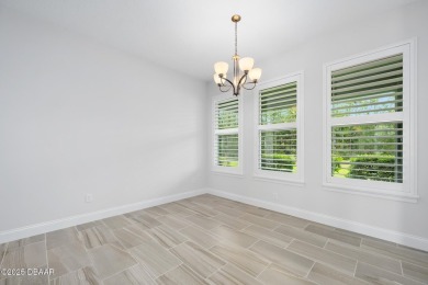 Enjoy peaceful water and wooded views in this beautifully on Venetian Bay Golf Course in Florida - for sale on GolfHomes.com, golf home, golf lot