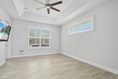 Enjoy peaceful water and wooded views in this beautifully on Venetian Bay Golf Course in Florida - for sale on GolfHomes.com, golf home, golf lot