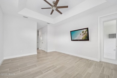 Enjoy peaceful water and wooded views in this beautifully on Venetian Bay Golf Course in Florida - for sale on GolfHomes.com, golf home, golf lot
