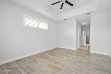 Enjoy peaceful water and wooded views in this beautifully on Venetian Bay Golf Course in Florida - for sale on GolfHomes.com, golf home, golf lot