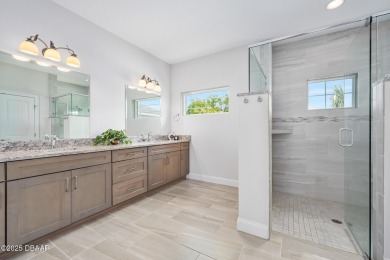 Enjoy peaceful water and wooded views in this beautifully on Venetian Bay Golf Course in Florida - for sale on GolfHomes.com, golf home, golf lot