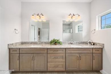 Enjoy peaceful water and wooded views in this beautifully on Venetian Bay Golf Course in Florida - for sale on GolfHomes.com, golf home, golf lot