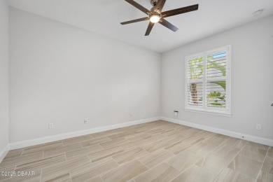 Enjoy peaceful water and wooded views in this beautifully on Venetian Bay Golf Course in Florida - for sale on GolfHomes.com, golf home, golf lot