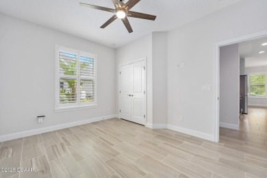 Enjoy peaceful water and wooded views in this beautifully on Venetian Bay Golf Course in Florida - for sale on GolfHomes.com, golf home, golf lot