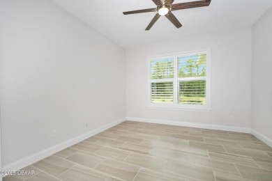 Enjoy peaceful water and wooded views in this beautifully on Venetian Bay Golf Course in Florida - for sale on GolfHomes.com, golf home, golf lot
