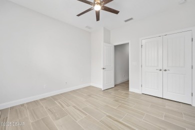 Enjoy peaceful water and wooded views in this beautifully on Venetian Bay Golf Course in Florida - for sale on GolfHomes.com, golf home, golf lot