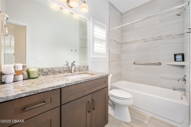 Enjoy peaceful water and wooded views in this beautifully on Venetian Bay Golf Course in Florida - for sale on GolfHomes.com, golf home, golf lot