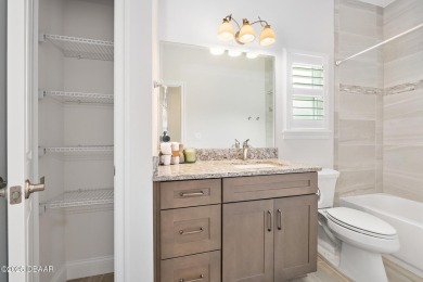 Enjoy peaceful water and wooded views in this beautifully on Venetian Bay Golf Course in Florida - for sale on GolfHomes.com, golf home, golf lot