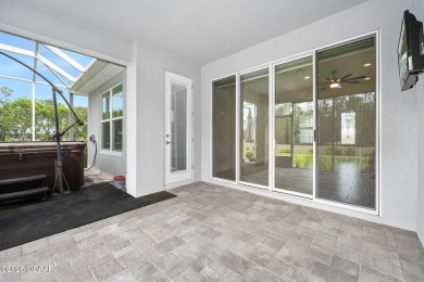 Enjoy peaceful water and wooded views in this beautifully on Venetian Bay Golf Course in Florida - for sale on GolfHomes.com, golf home, golf lot