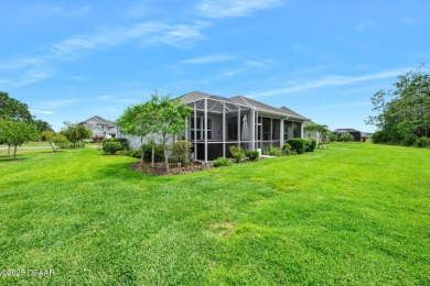 Enjoy peaceful water and wooded views in this beautifully on Venetian Bay Golf Course in Florida - for sale on GolfHomes.com, golf home, golf lot