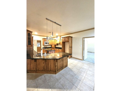 Nice all-brick home with vinyl accents located on Magellan Golf on Magellan Golf Course in Arkansas - for sale on GolfHomes.com, golf home, golf lot