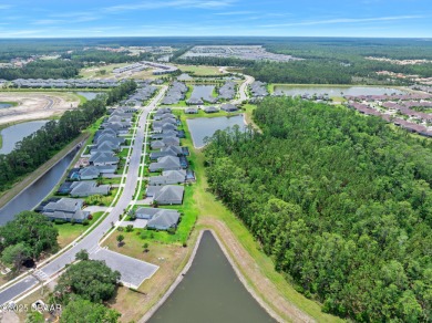 Enjoy peaceful water and wooded views in this beautifully on Venetian Bay Golf Course in Florida - for sale on GolfHomes.com, golf home, golf lot
