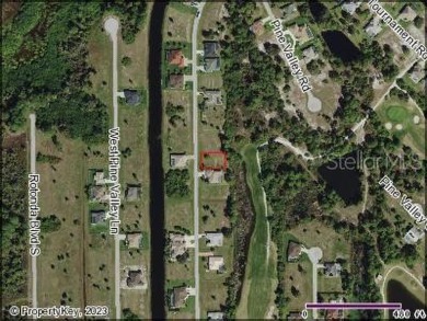 A cleared residential building lot backing up to the 1st Tee Box on Rotonda Golf and Country Club - Long Marsh  in Florida - for sale on GolfHomes.com, golf home, golf lot